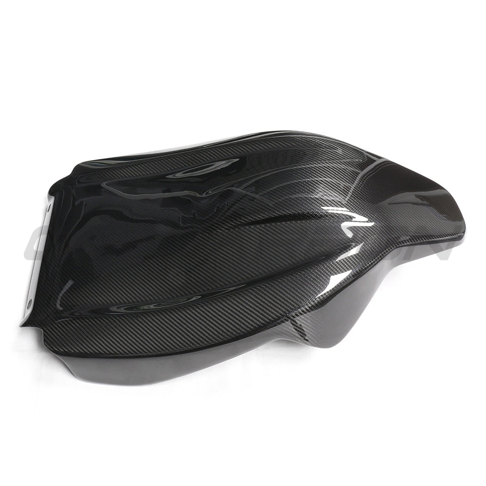 BMW GXX/F9X full carbon fiber seats backs by CT Carbon, showcasing sleek, lightweight carbon fiber material with detailed weave pattern.