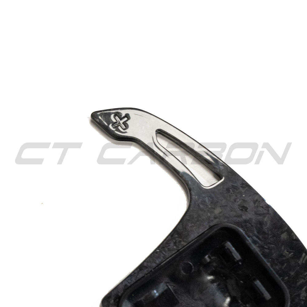 BMW Gxx forged carbon fiber shifter paddles by CT Carbon, showcasing sleek, lightweight racing-style accessories for BMW vehicles.