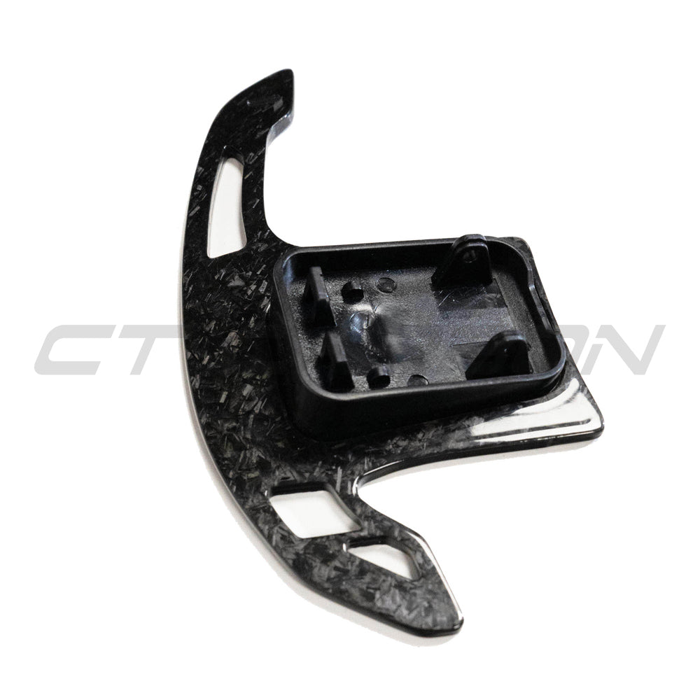 BMW Gxx forged carbon fiber shifter paddles by CT Carbon, showing sleek, lightweight carbon fiber design for enhanced driving style.