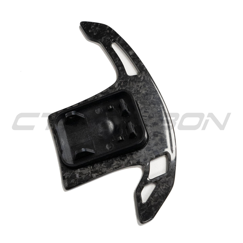 BMW Gxx forged carbon fiber shifter paddles by CT Carbon, showing sleek black lightweight racing-style accessories.