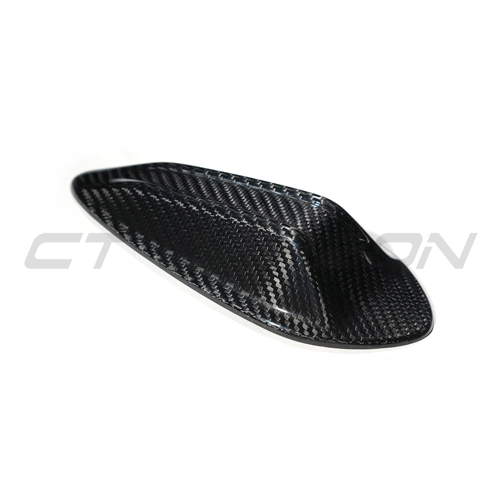 BMW Gxx G42 G80 G82 G20 G22 G87 carbon fibre antenna cover by CT Carbon, showing sleek black textured finish on car antenna.