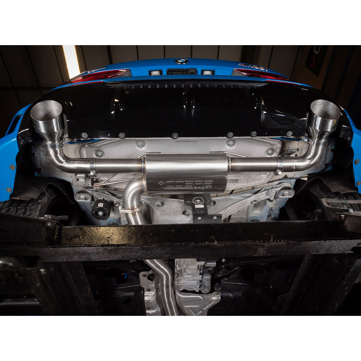 BMW M135i F40 Cobra Sport cat back performance exhaust with polished tips and sleek design.