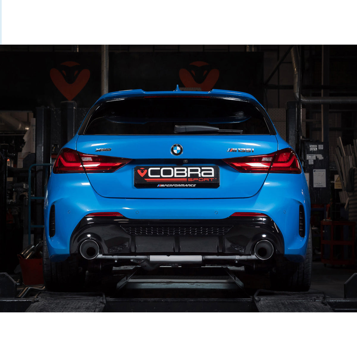 Cobra Sport cat back exhaust system installed on a BMW M135i F40, showcasing the polished stainless steel exhaust tips.