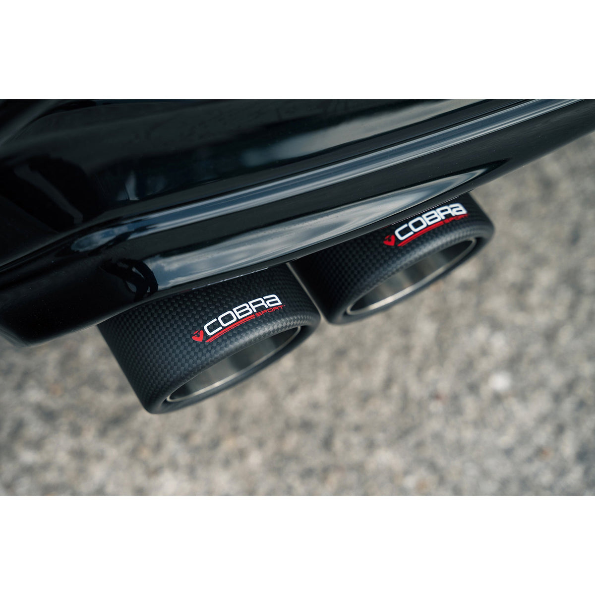 Cobra Sport BMW M135i F40 quad exit GPF/OPF back exhaust with M3 style performance design on a lifestyle background.