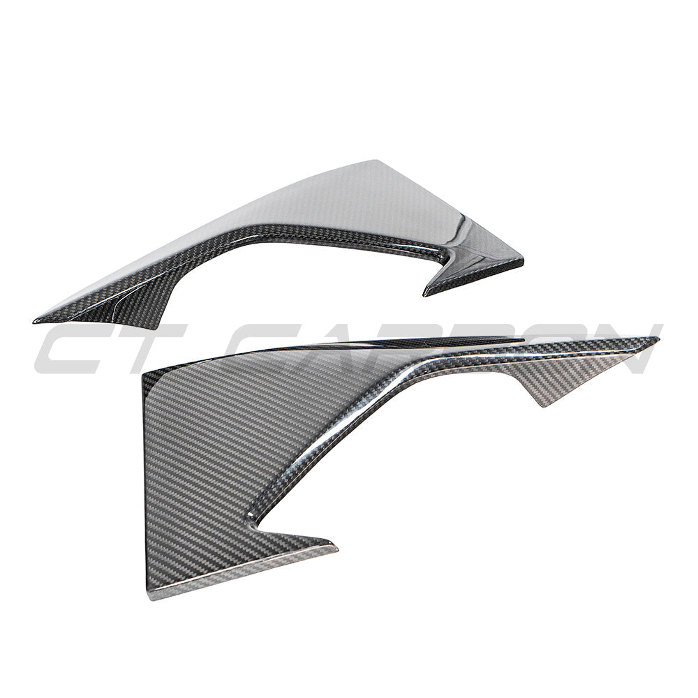 BMW M2 F87 N55 carbon fiber front bumper corners by CT Carbon, showing sleek, textured carbon fiber detailing on a sporty car.