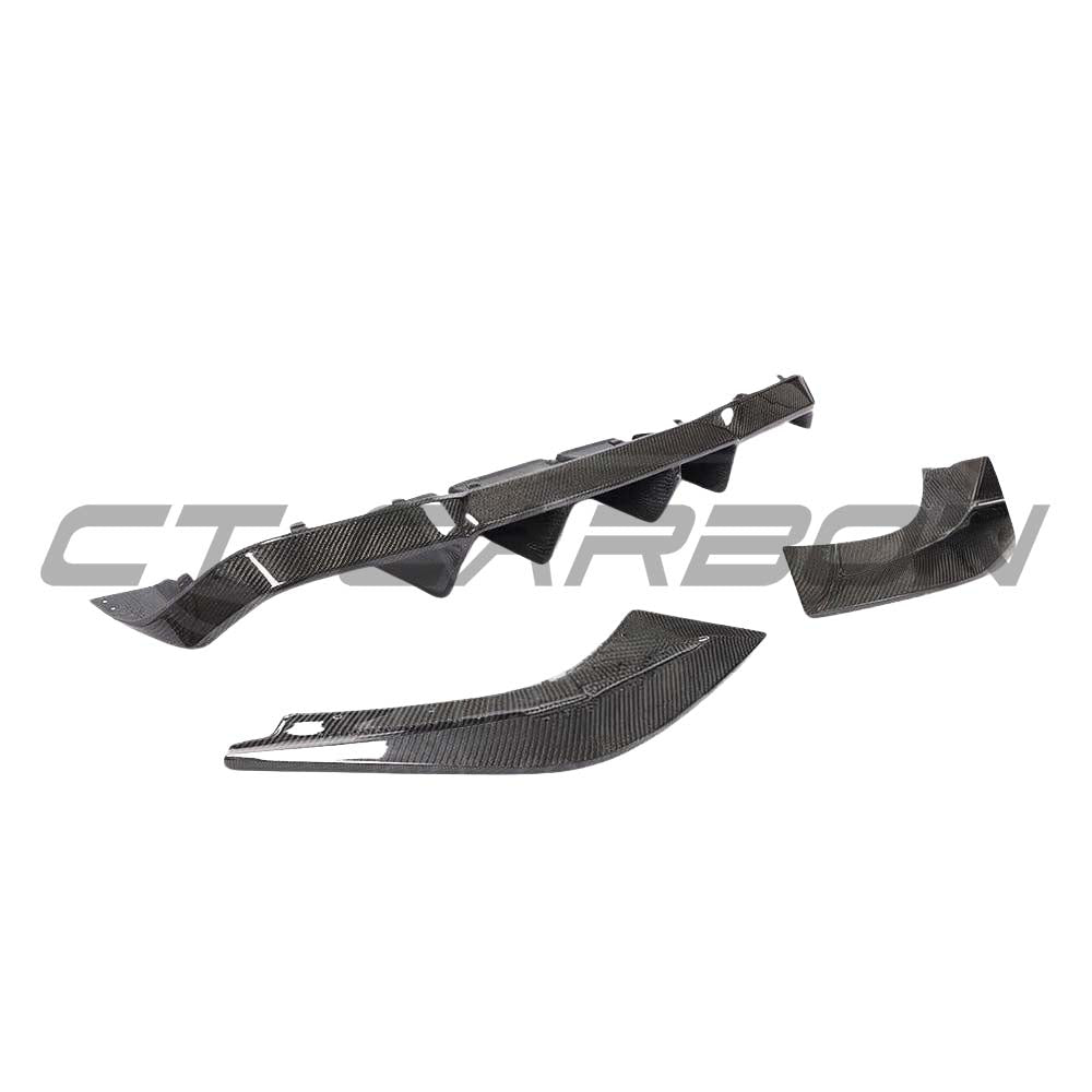BMW M2 F87 carbon fibre diffuser by CT Carbon, V3 style, showcasing sleek aerodynamic design and textured carbon fiber finish.