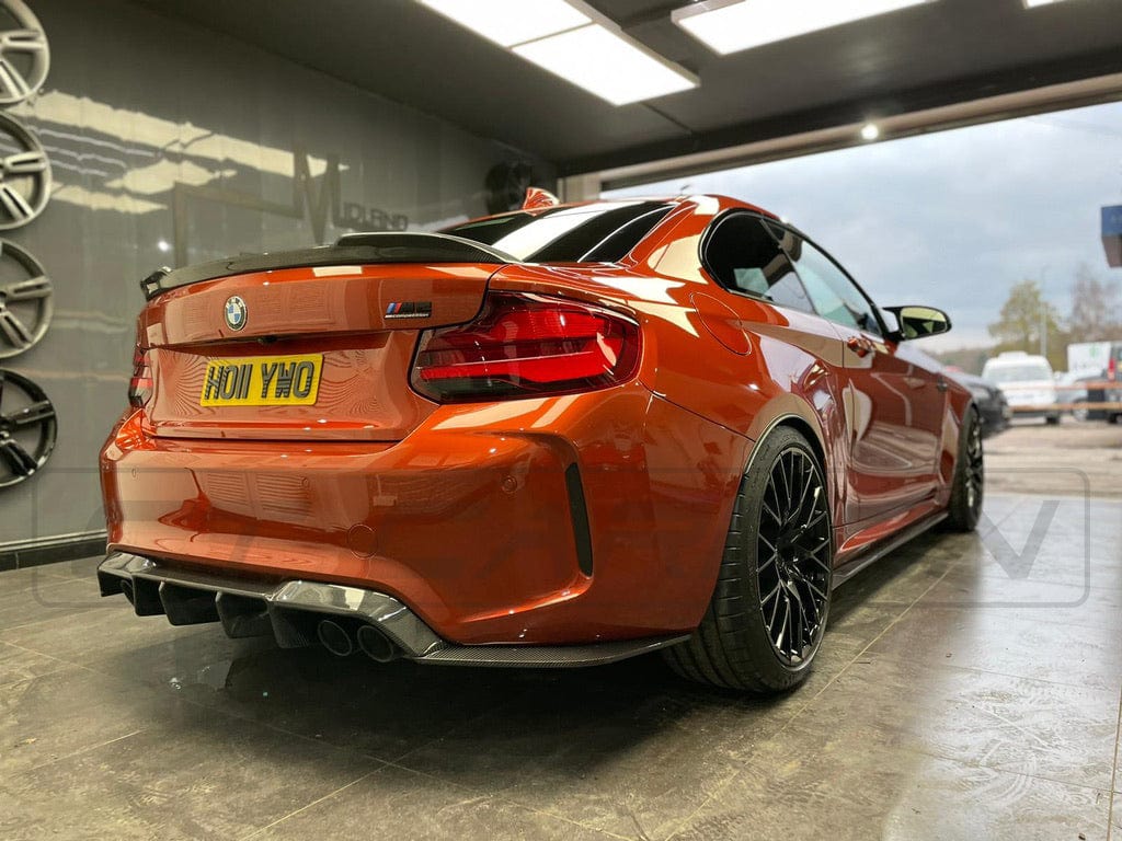 BMW M2 F87 carbon fibre diffuser by CT Carbon, V3 style, showcasing sleek aerodynamic design and high-quality carbon fiber finish.