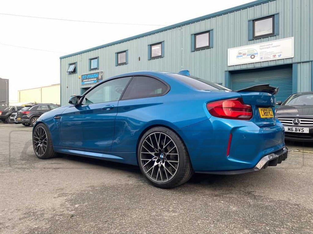 BMW M2 F87 carbon fibre diffuser by CT Carbon, V3 style, showcasing sleek aerodynamic design and high-quality carbon fiber finish.