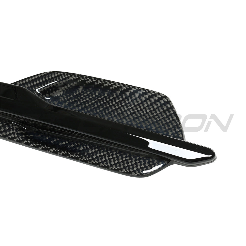 BMW M2 M2C F87 carbon fiber side vents by CT Carbon, close-up view showing sleek aerodynamic design and textured carbon fiber finish.