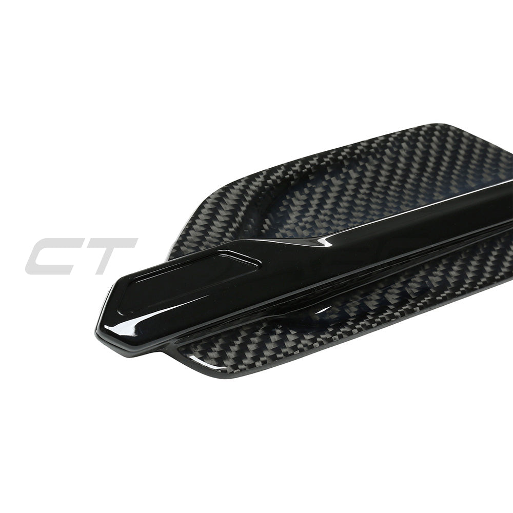BMW M2 M2C F87 carbon fiber side vents by CT Carbon, close-up of sleek, lightweight automotive accessories on the car's side.
