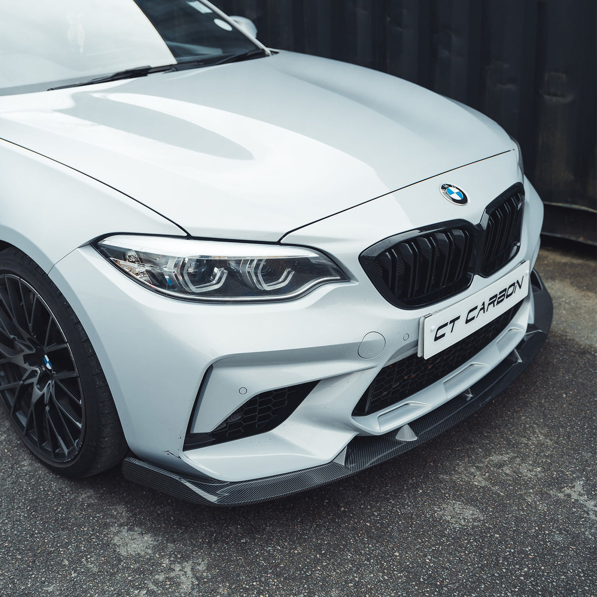 BMW M2C F87 carbon fibre splitter V2 by CT Carbon, showing sleek 3D-style design attached to the front bumper.