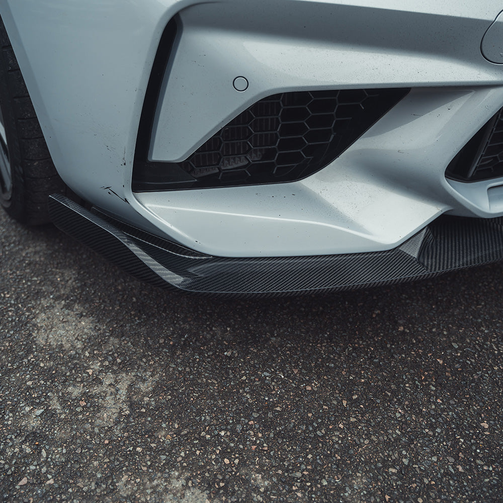 BMW M2C F87 carbon fibre splitter V2 by CT Carbon, showing the sleek 3D-style aerodynamic design on the car's front.