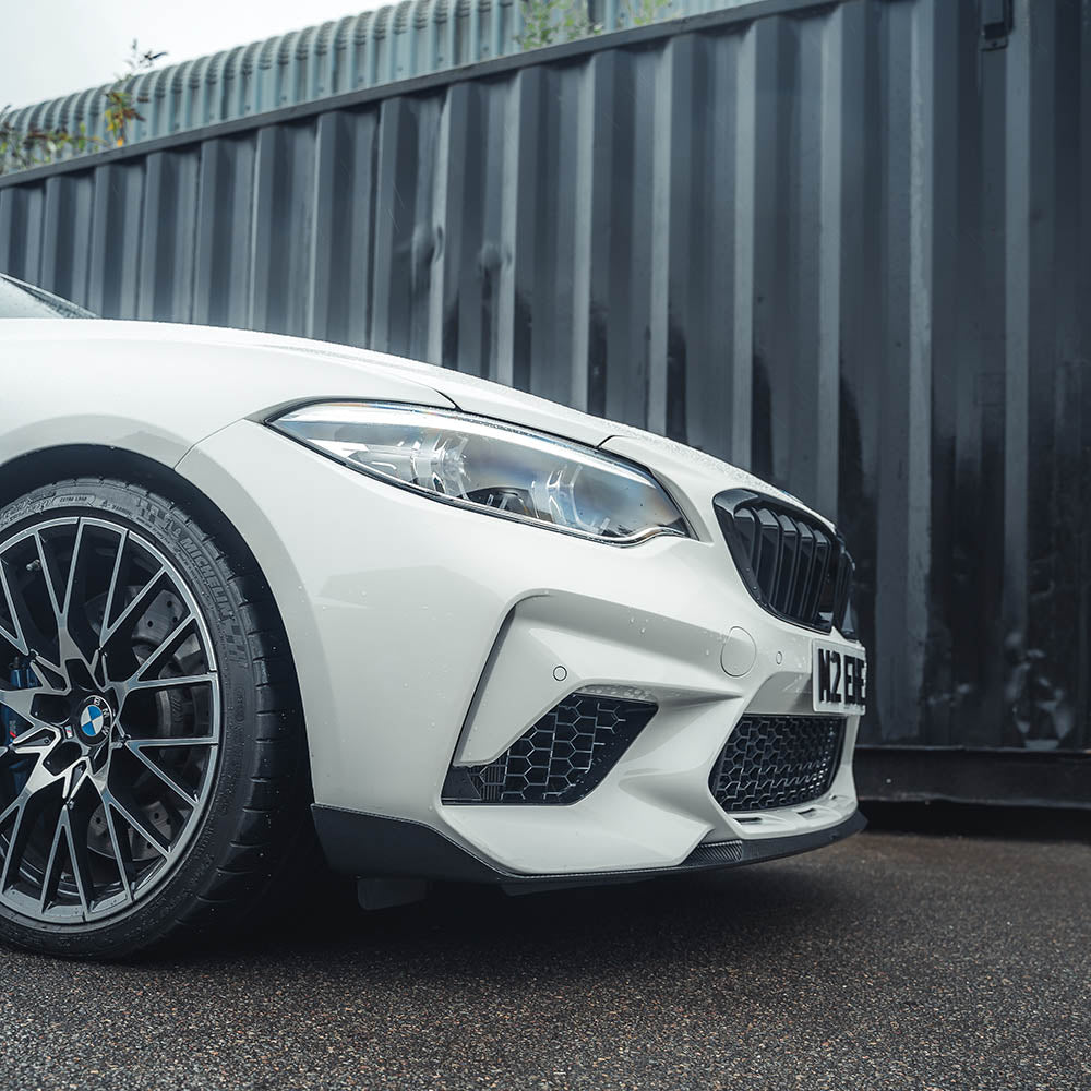 BMW F87 M2C CT Carbon fibre splitter V3, aerodynamic front splitter with carbon fiber finish on a sporty car.