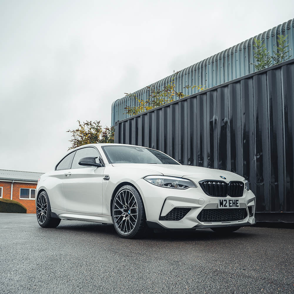 BMW F87 M2C carbon fibre splitter by CT Carbon, V3 version, showing the sleek aerodynamic design and textured carbon finish.