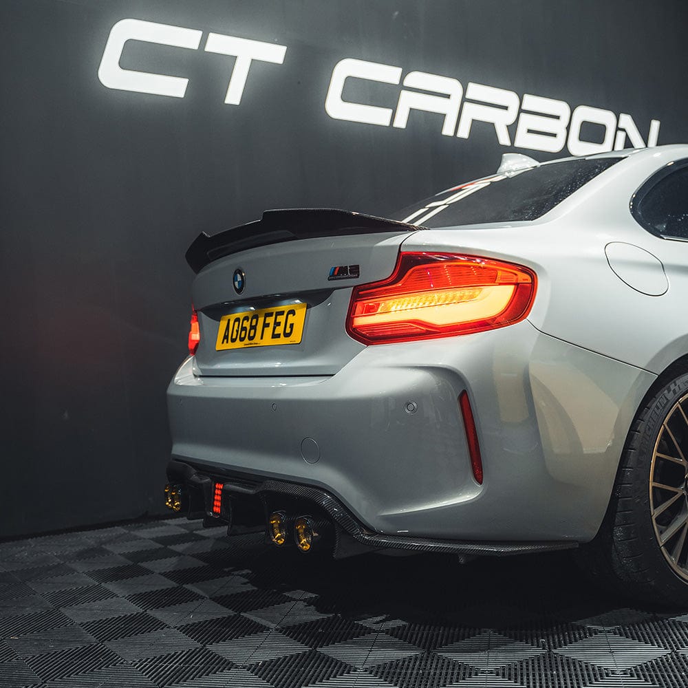BMW M2 F87 carbon fibre diffuser by CT Carbon with an aggressive design, showcasing the lightweight, high-performance automotive part.