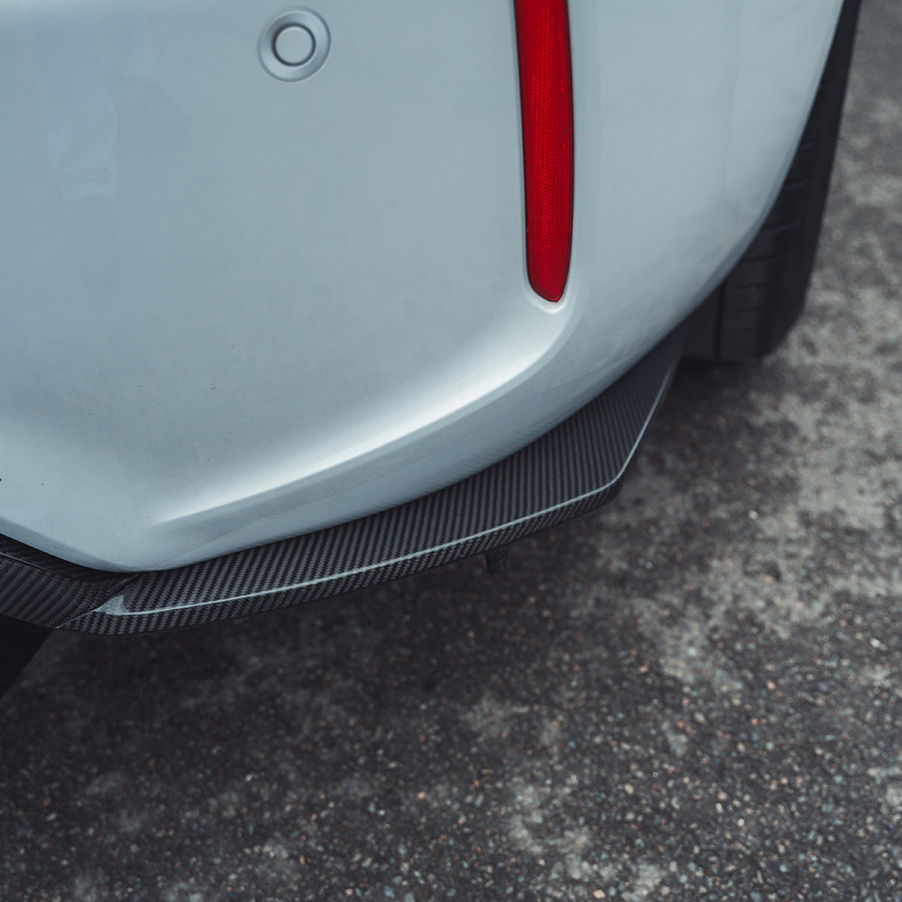 BMW M2 F87 carbon fibre diffuser by CT Carbon, showcasing an aggressive design with detailed V6 carbon fibre texture.