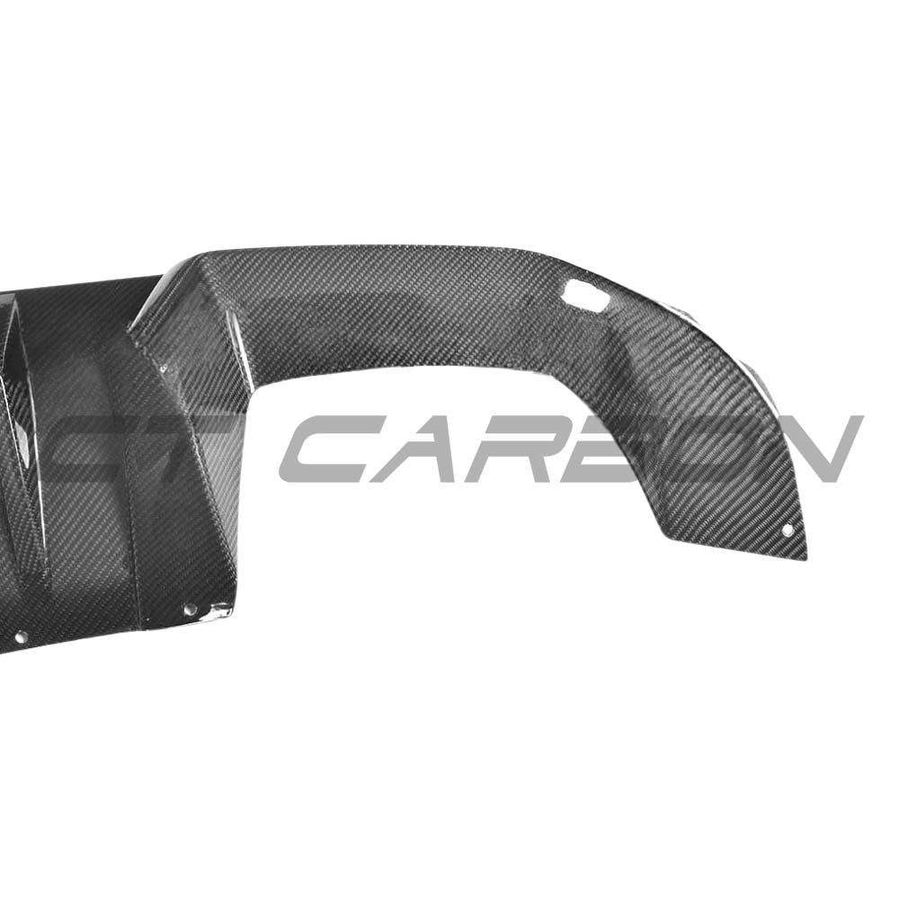 BMW M2 F87 carbon fiber diffuser by CT Carbon, V2 model, showcasing sleek aerodynamic design and high-quality carbon fiber finish.