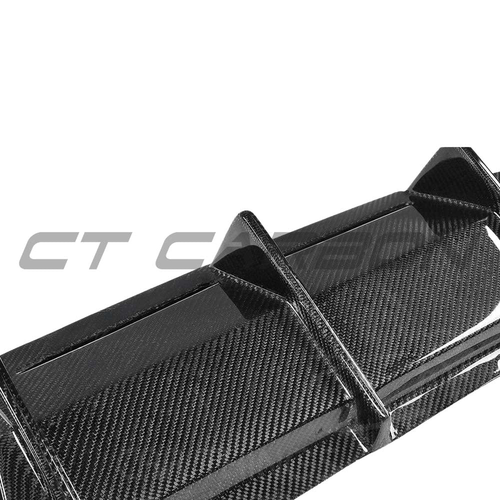 BMW M2 F87 carbon fibre diffuser by CT Carbon, V4 style, showcasing sleek, textured carbon fiber design for sporty performance.