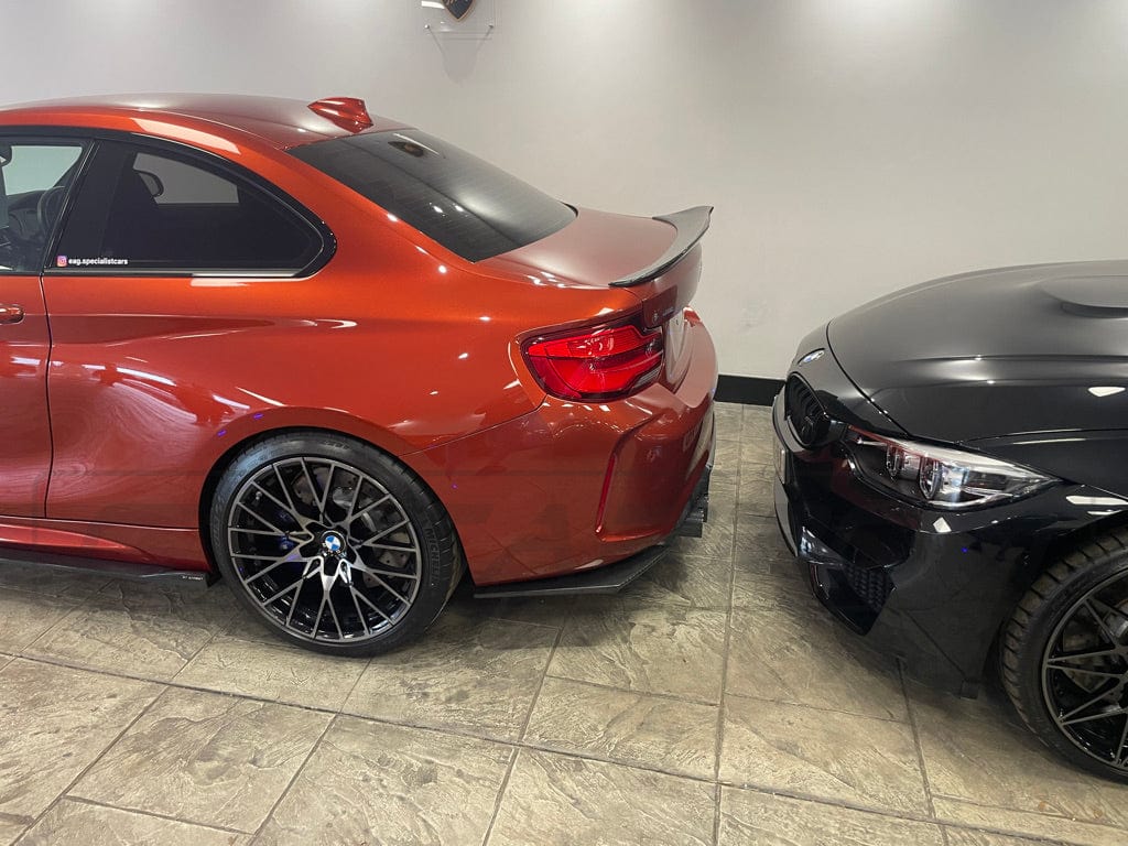BMW M2 M2C F87 carbon fibre diffuser by CT Carbon, showcasing sleek V4 style with detailed carbon fiber texture.