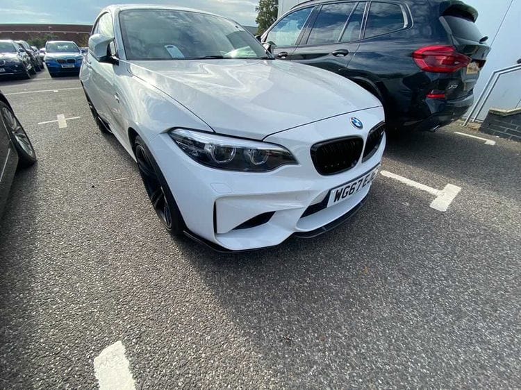 BMW M2 F87 carbon fibre middle splitter by CT Carbon, lightweight aerodynamic car part with sleek carbon fibre finish.