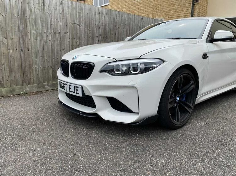 BMW M2 F87 carbon fiber middle splitter by CT Carbon, showcasing its sleek design and lightweight construction.