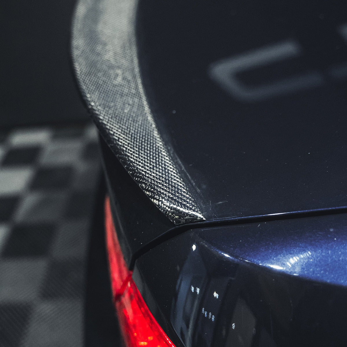BMW M3 and 3 Series E92 carbon fiber spoiler by CT Carbon, V1 style, showing sleek design and glossy black finish.
