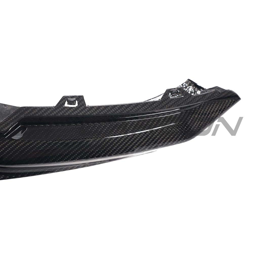BMW M3 G80/G81 carbon fibre diffuser by CT Design, showcasing sleek black carbon fiber with intricate aerodynamic detailing.
