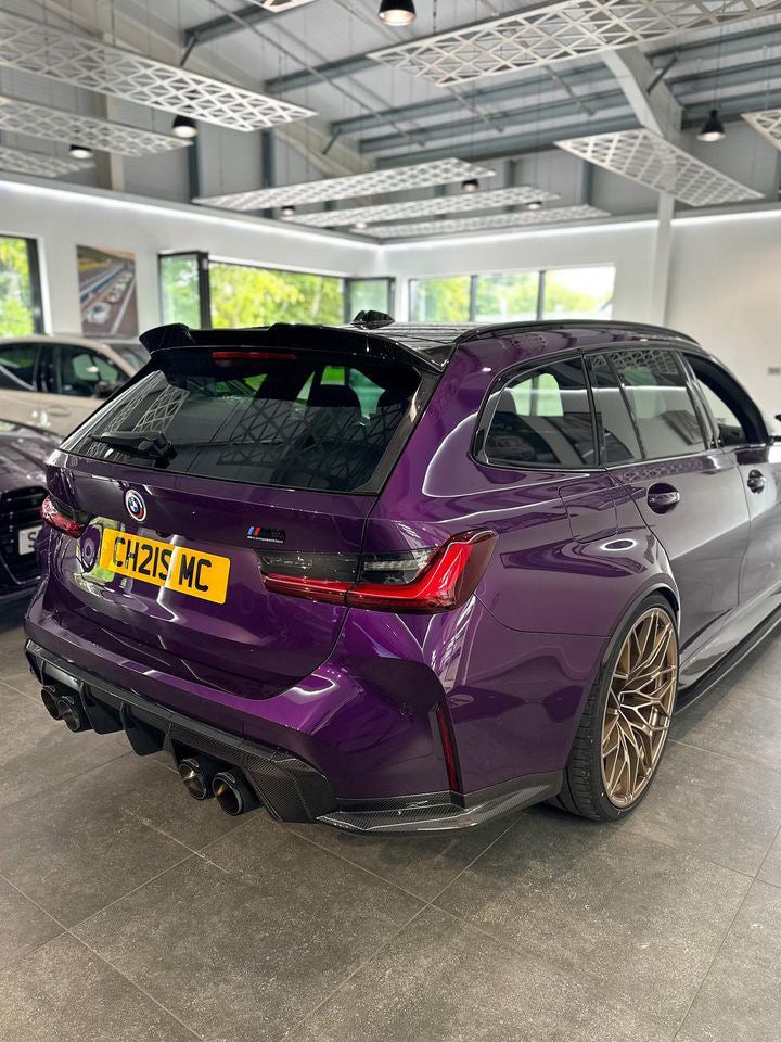 BMW M3 and M4 G80 G81 G82 G83 carbon fiber diffuser trim by CT Carbon, showcasing sleek, textured carbon fiber design.