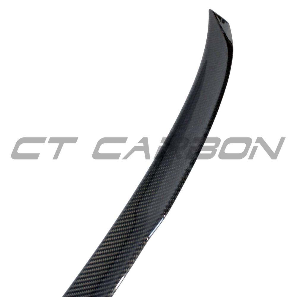 BMW G80 M3 full carbon fiber kit by CT Carbon, including spoiler and body parts, showcasing a sleek, black carbon fiber finish.