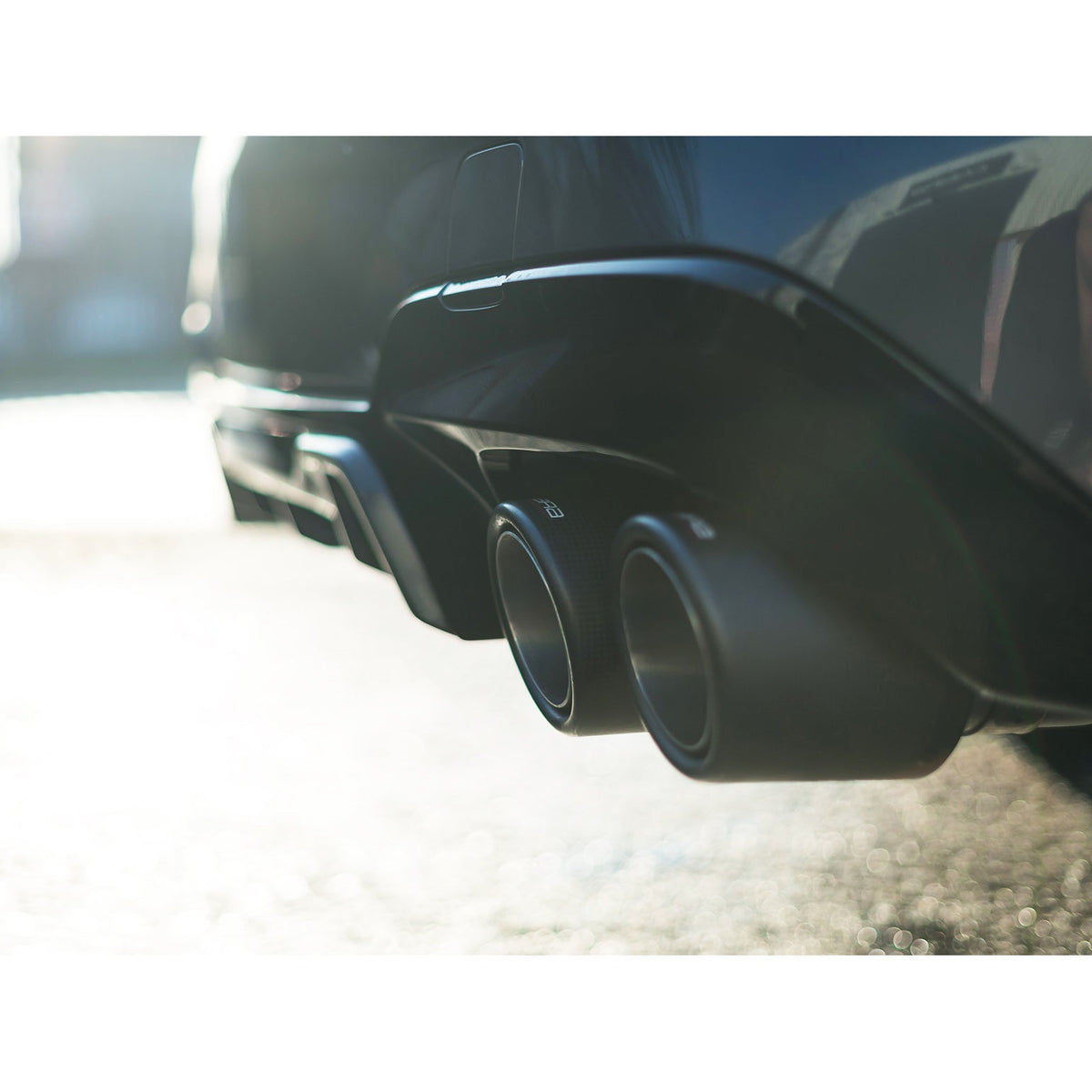 Cobra Sport GPF/PPF back performance exhaust installed on a BMW M440i G22, with quad exhaust tips and polished finish.