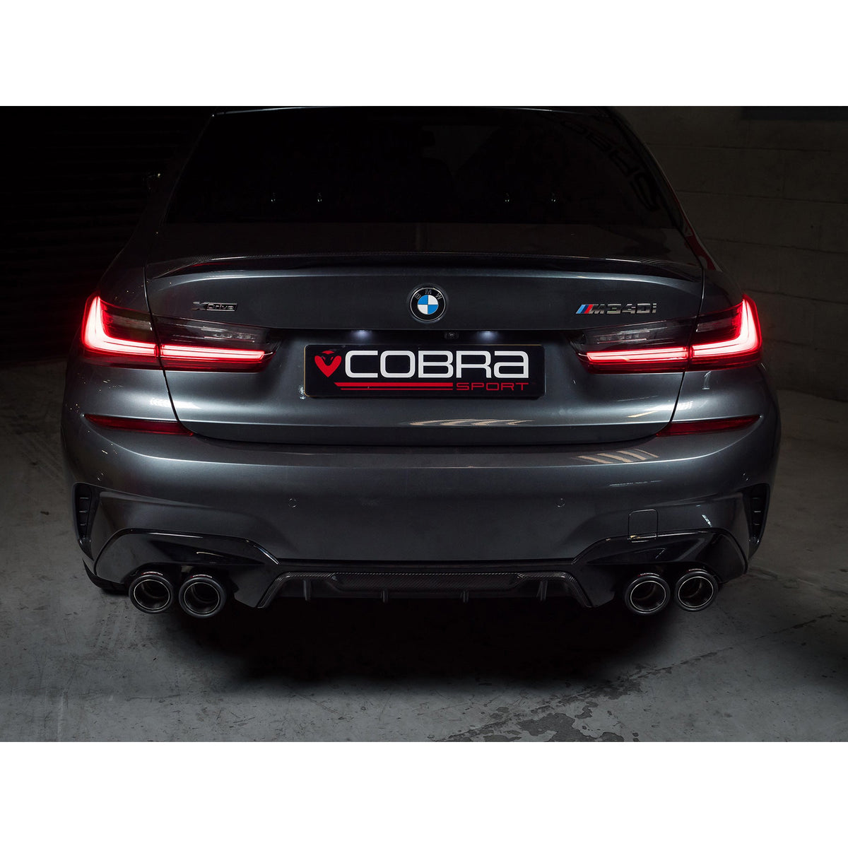 BMW M340i G20 Cobra Sport valved quad exit GPF/PPF back performance exhaust system installed on vehicle.