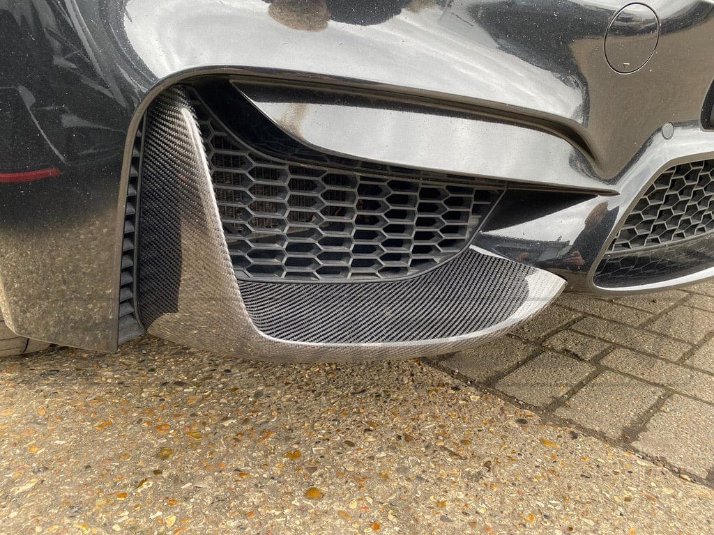 BMW M3 M4 F80 F82 F83 carbon splitter by CT Carbon, showing sleek aerodynamic design for 2014-2020 models.