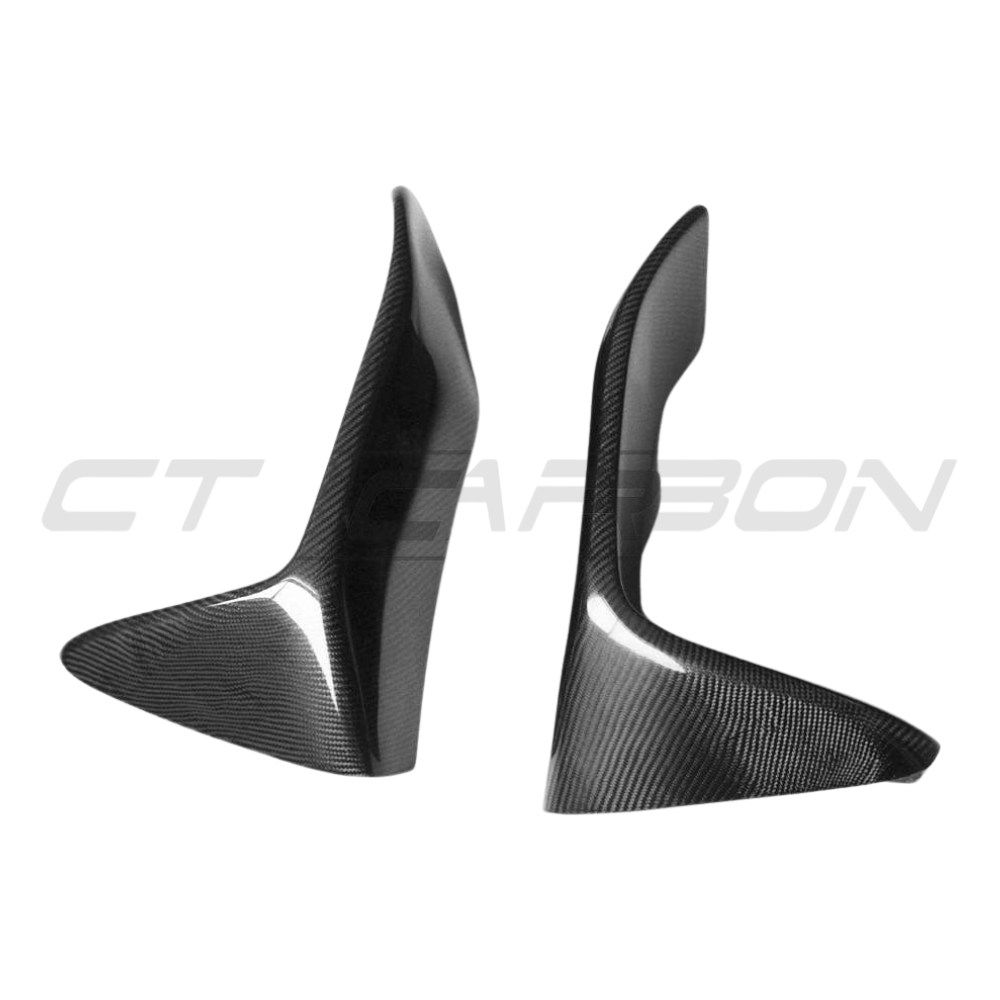 BMW M3 M4 F80 F82 F83 carbon canards and splitters by CT Carbon, showing sleek aerodynamic enhancements on the front bumper.