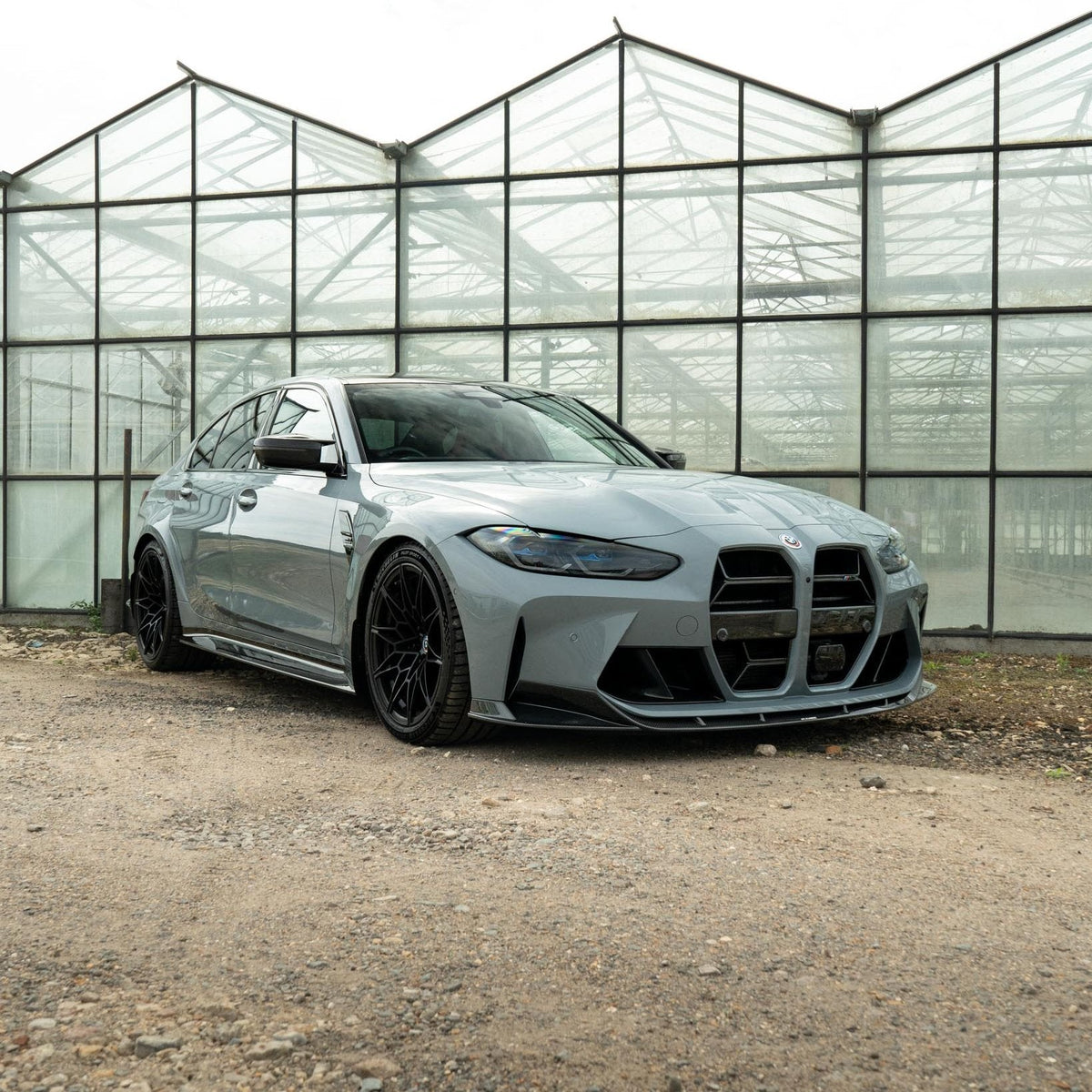 BMW M3 M4 G80 G82 G83 carbon fibre splitter by CT Carbon, showcasing its sleek, lightweight aerodynamic design.