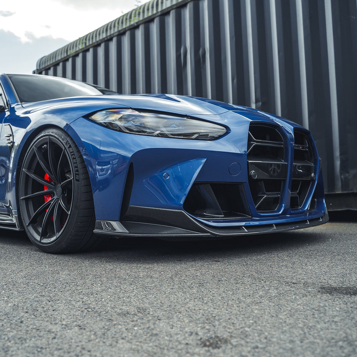 BMW M3 M4 G80 G81 G82 G83 carbon fibre splitter by CT Carbon, showcasing its sleek, lightweight aerodynamic design.