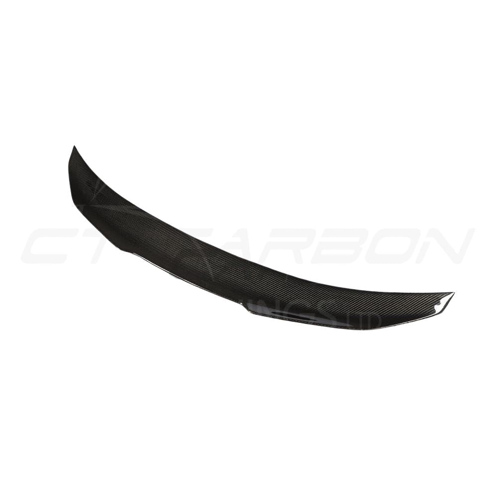 BMW M4 F82 carbon fiber spoiler, Ducktail PS style, by CT Carbon, showing sleek aerodynamic design on the car's rear.