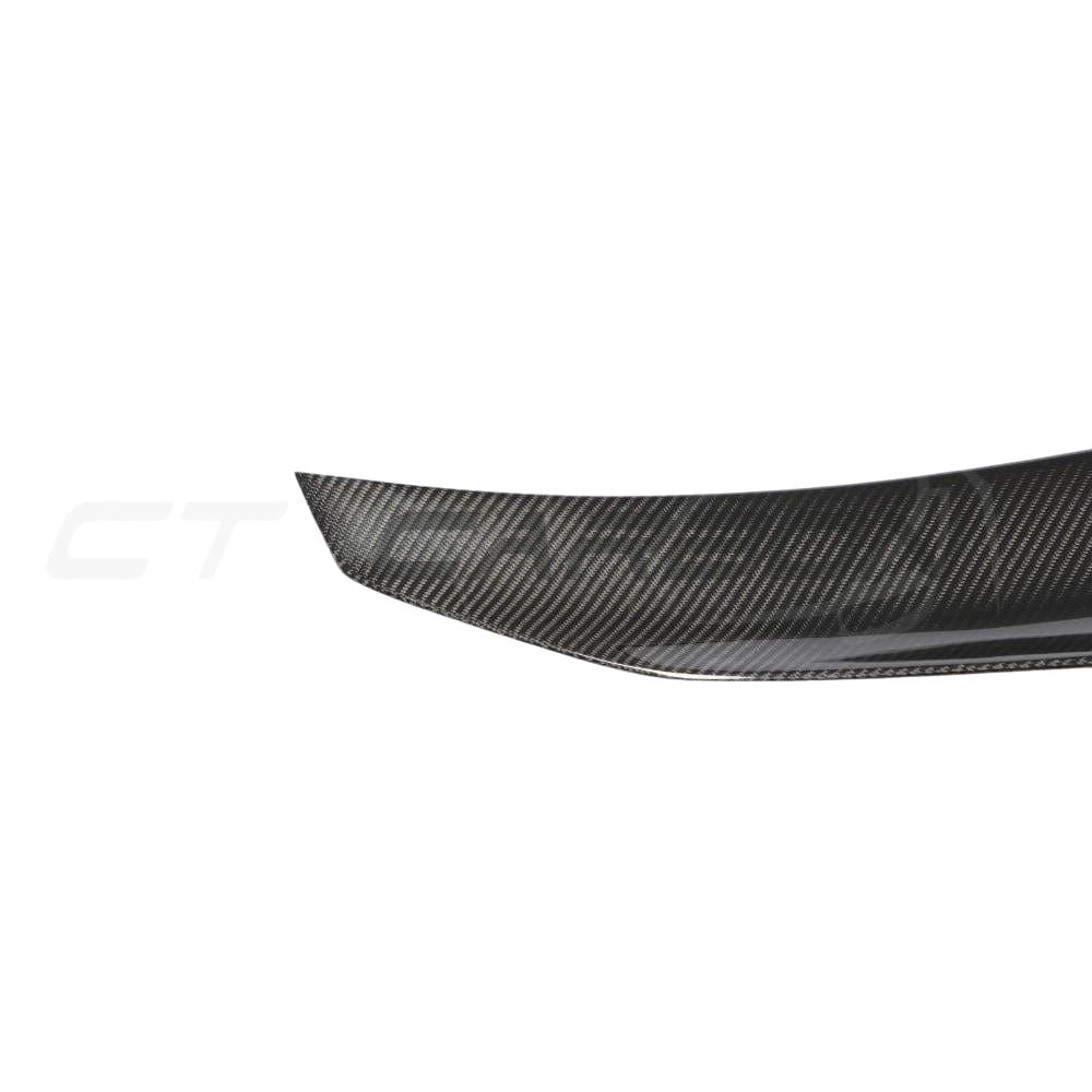 BMW M4 F82 carbon fiber spoiler with ducktail PS style by CT Carbon, showing the sleek, aerodynamic design on the car's rear.