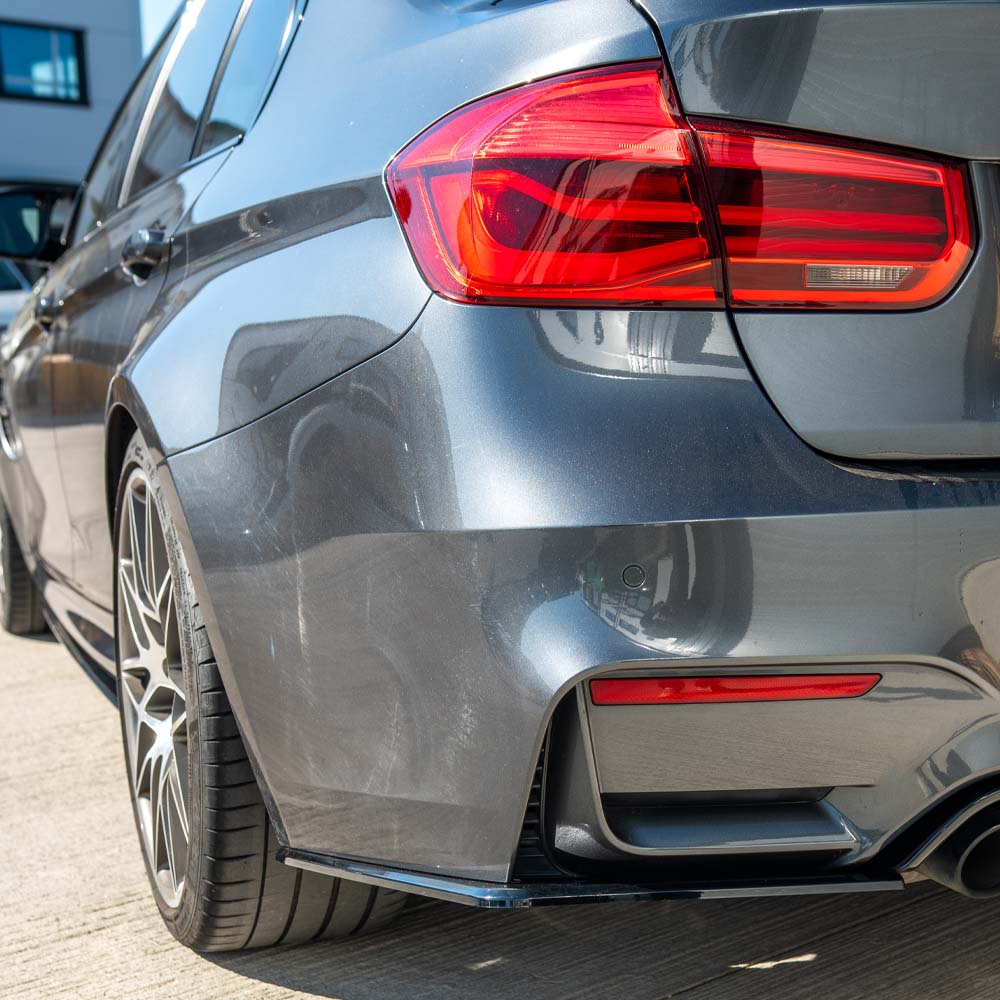 BMW M4 F82 coupe with full gloss black kit by CT Carbon, showcasing sleek black body accents and detailed exterior components.
