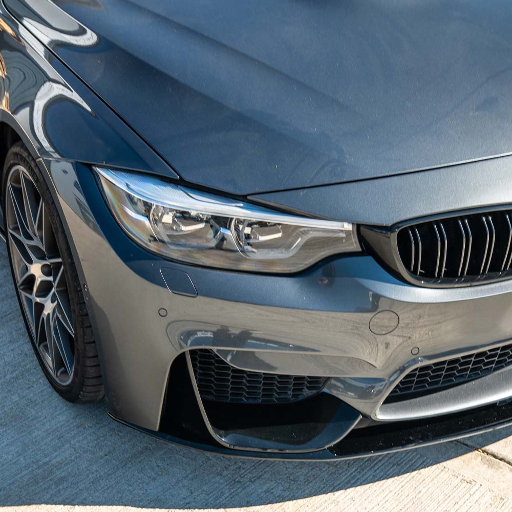 BMW M3 F80 2014-2020 CT Carbon full gloss black kit installed on coupe, showcasing sleek, high-gloss black exterior enhancements.