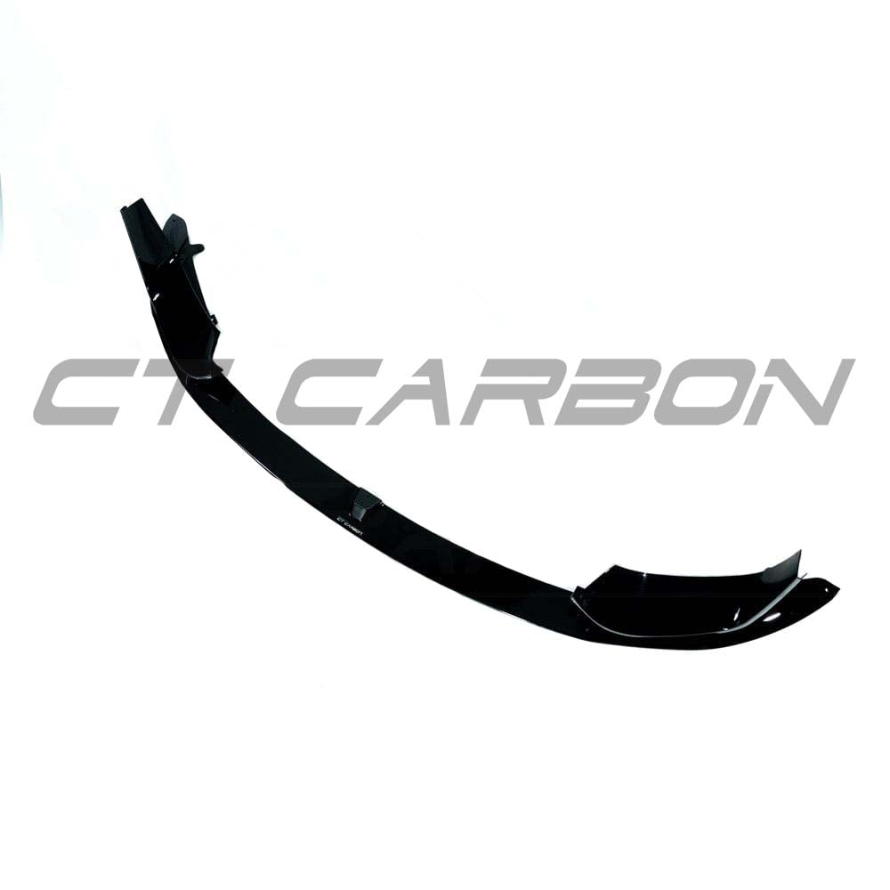 BMW M4 F82 coupe with full gloss black kit by CT Carbon, showcasing sleek black exterior components and aerodynamic design.