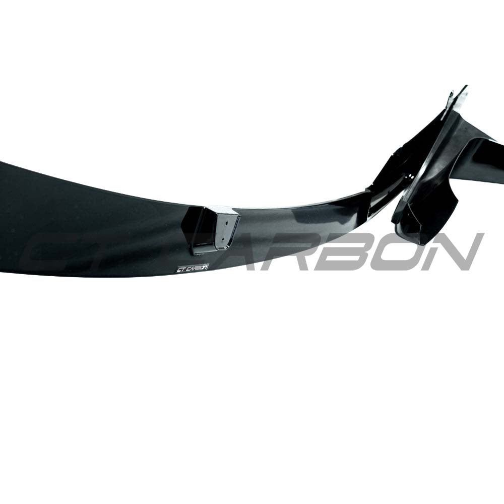 BMW M4 F82 coupe with CT Carbon full gloss black kit showing aerodynamic body kit and sleek black finish.