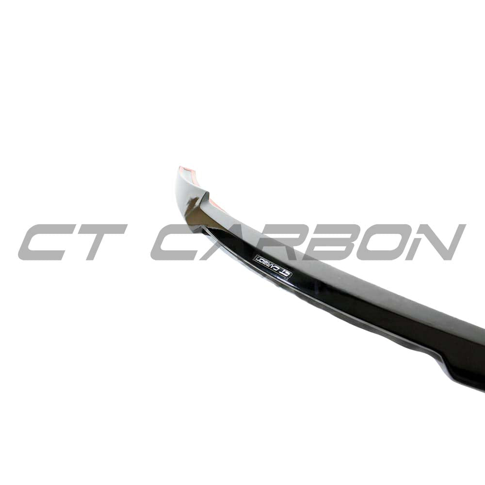 Gloss black V-style spoiler for BMW M4 F82, made by CT Carbon, shown on the rear of the sports car.