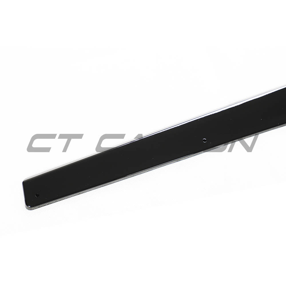 BMW M4 F82 coupe full gloss black kit by CT Carbon, showing detailed exterior parts on a sleek black BMW M4 coupe.