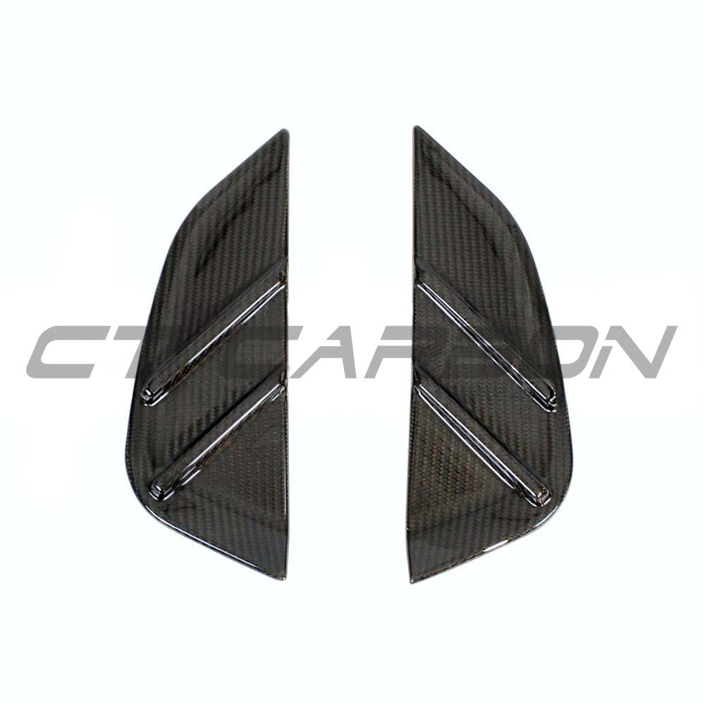 BMW M4 G82 G83 carbon fibre replacement side fender trim by CT Carbon, close-up showing sleek, textured carbon fibre finish.