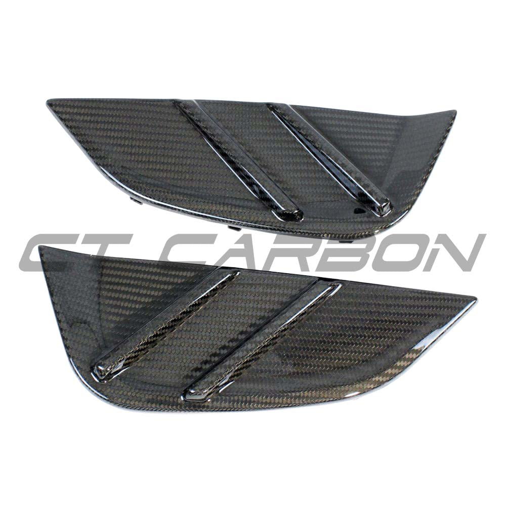 BMW M4 G82 G83 carbon fiber replacement side fender trim by CT Carbon, showcasing sleek, lightweight accessory for vehicle enhancement.