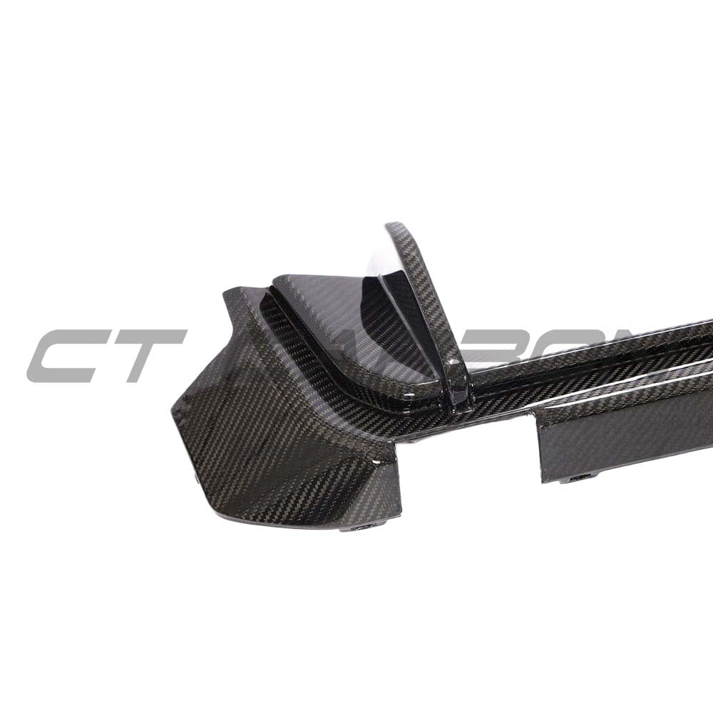 BMW M4 G82 G83 carbon fiber diffuser by CT Carbon, showcasing sleek black carbon fiber with aerodynamic design details.