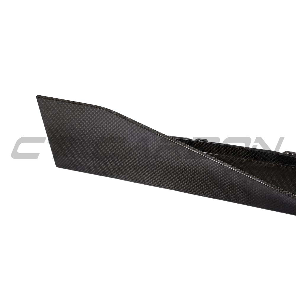 BMW G82 M4 full carbon fiber kit by CT Carbon, including side skirts with MP style, showcasing a sleek carbon fiber finish.