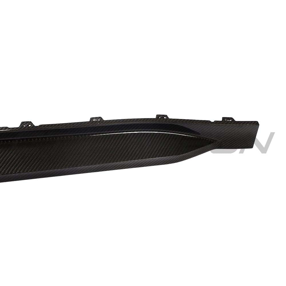 BMW G82 M4 full carbon fiber kit by CT Carbon, showing sleek side skirts with MP style design on a black M4 G82.