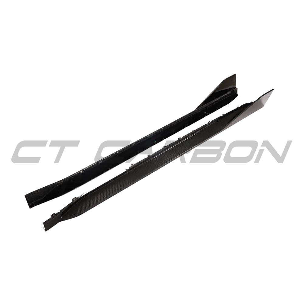 BMW G82 M4 carbon fibre side skirts kit by CT Carbon, featuring sleek MP style design on a black M4 G82 car.