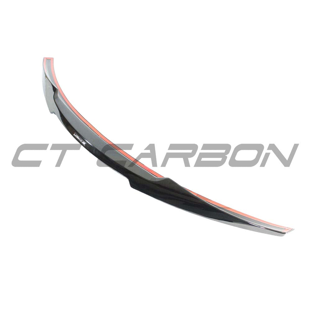 BMW M4 F33 F83 convertible gloss black spoiler by CT Carbon, showcasing a sleek, aerodynamic design on the car's rear.